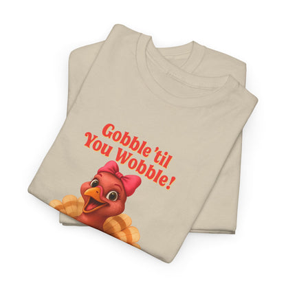 Gobble ’Til You Wobble Turkey Shirt – Funny Thanksgiving Tee, Smiling Female Turkey with Coquette Bow, Friendsgiving Graphic Top - Sand