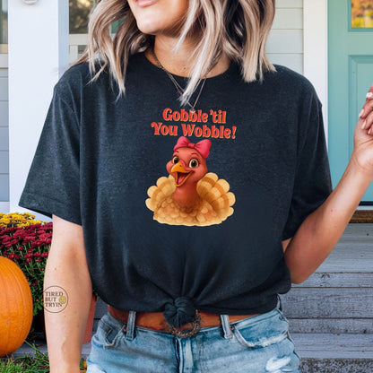 Gobble ’Til You Wobble Turkey Shirt – Funny Thanksgiving Tee, Smiling Female Turkey with Coquette Bow, Friendsgiving Graphic Top - Dark Heather